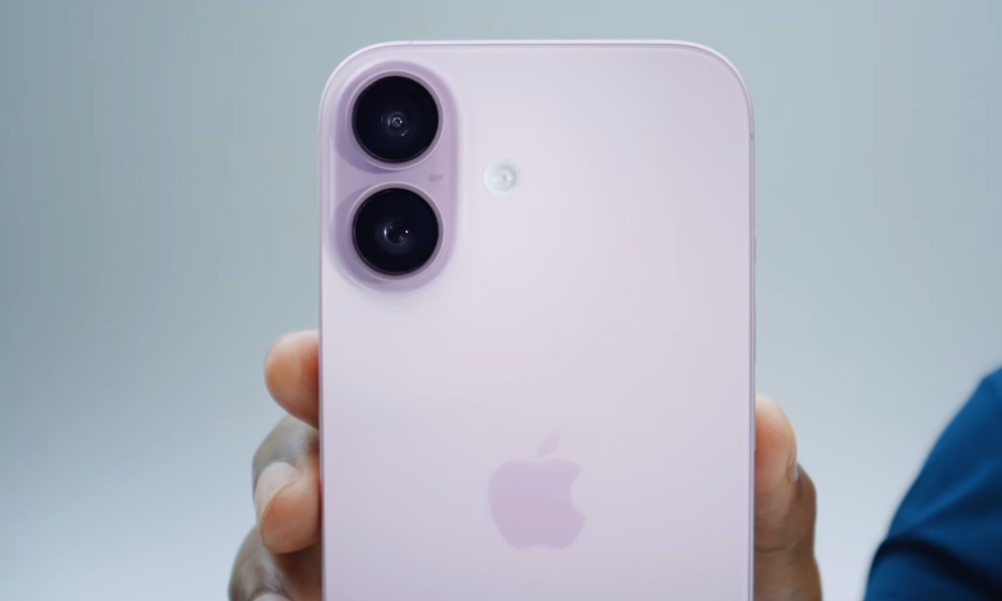 Person holding iPhone 17.
