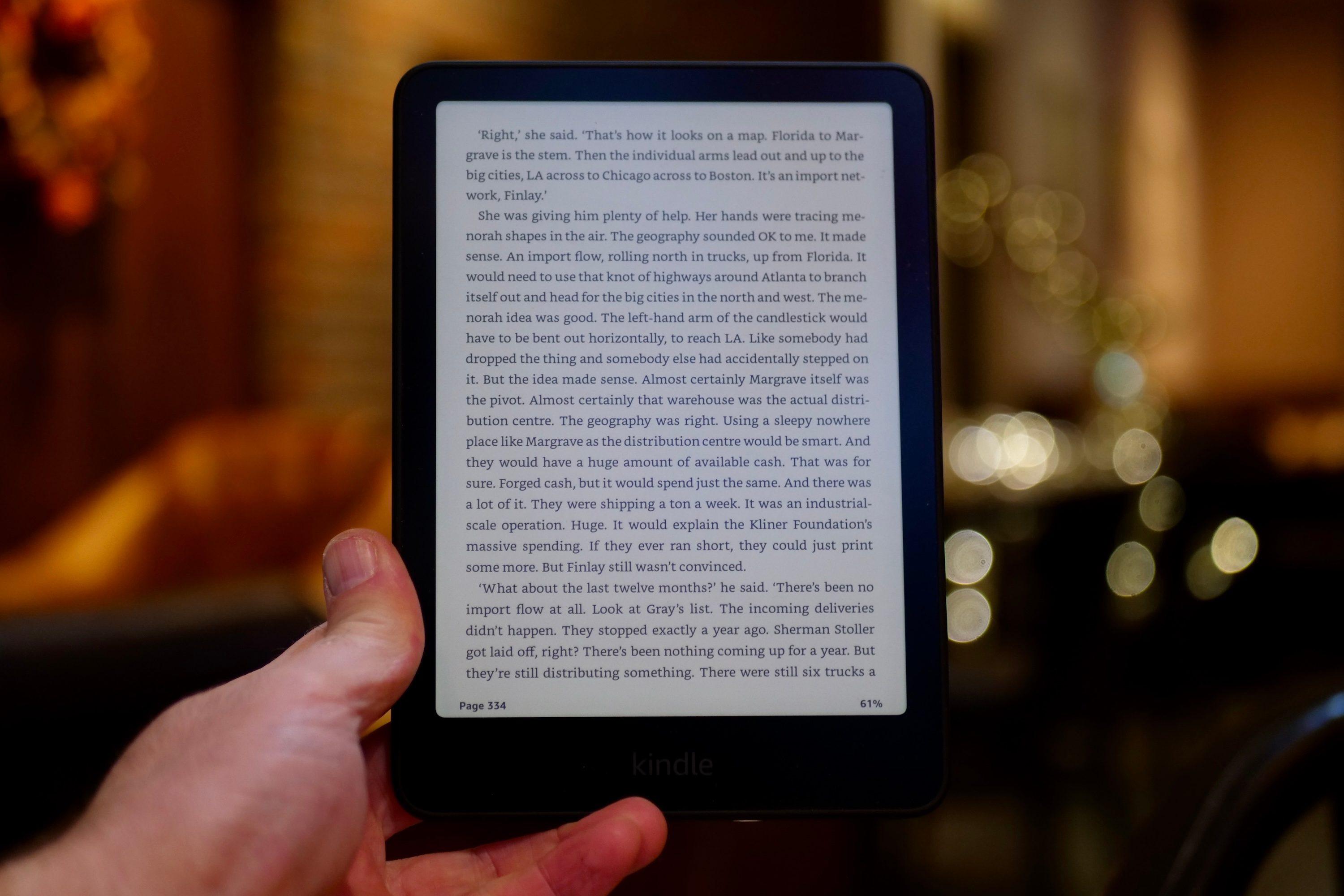Person holding Kindle Paperwhite.