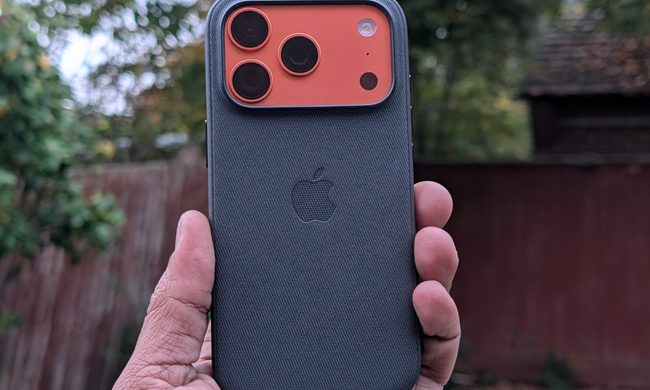 Apple TechWoven Case on the iPhone 17 Pro in Cosmic Orange