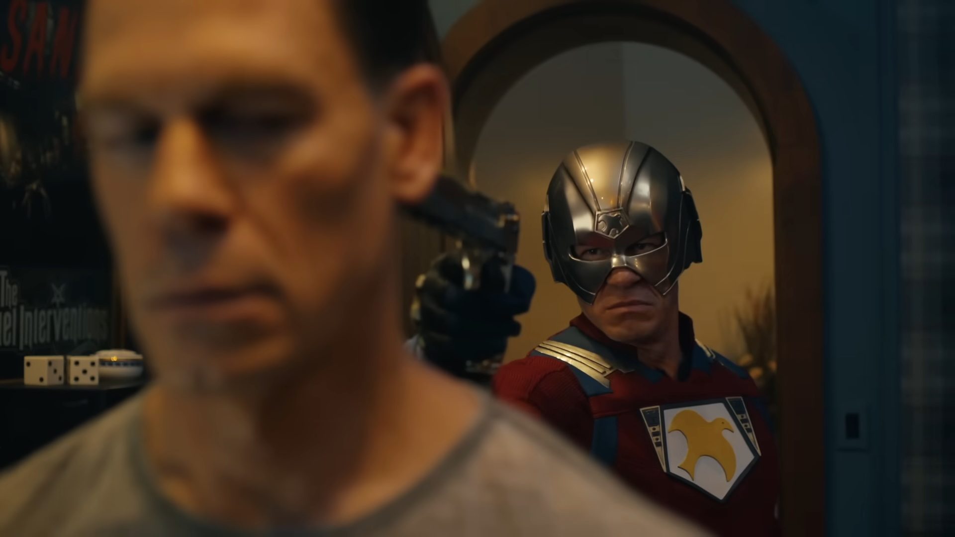John Cena pointing a gun at another John Cena in Peacemaker season 2.