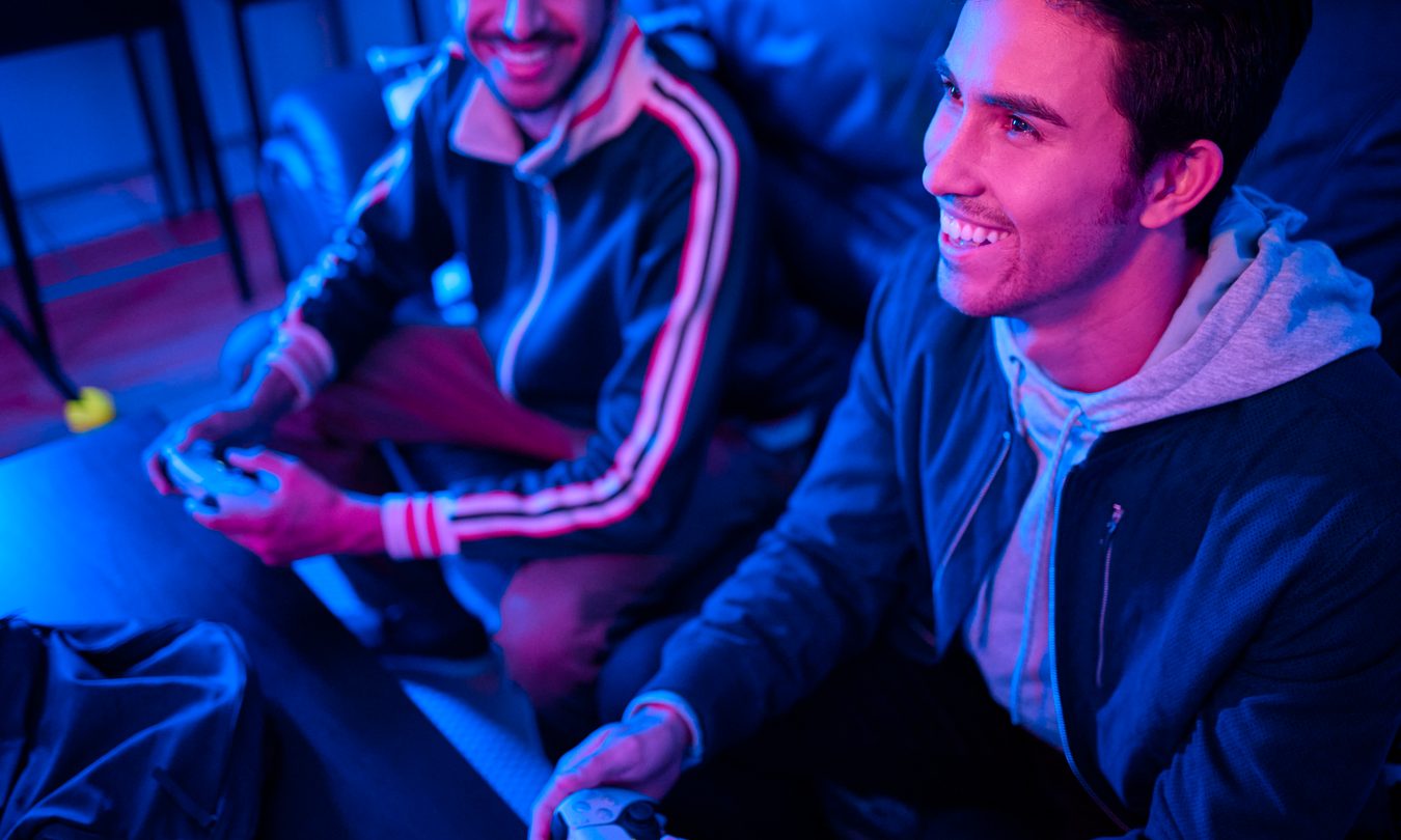 two gamers and one looking at the other