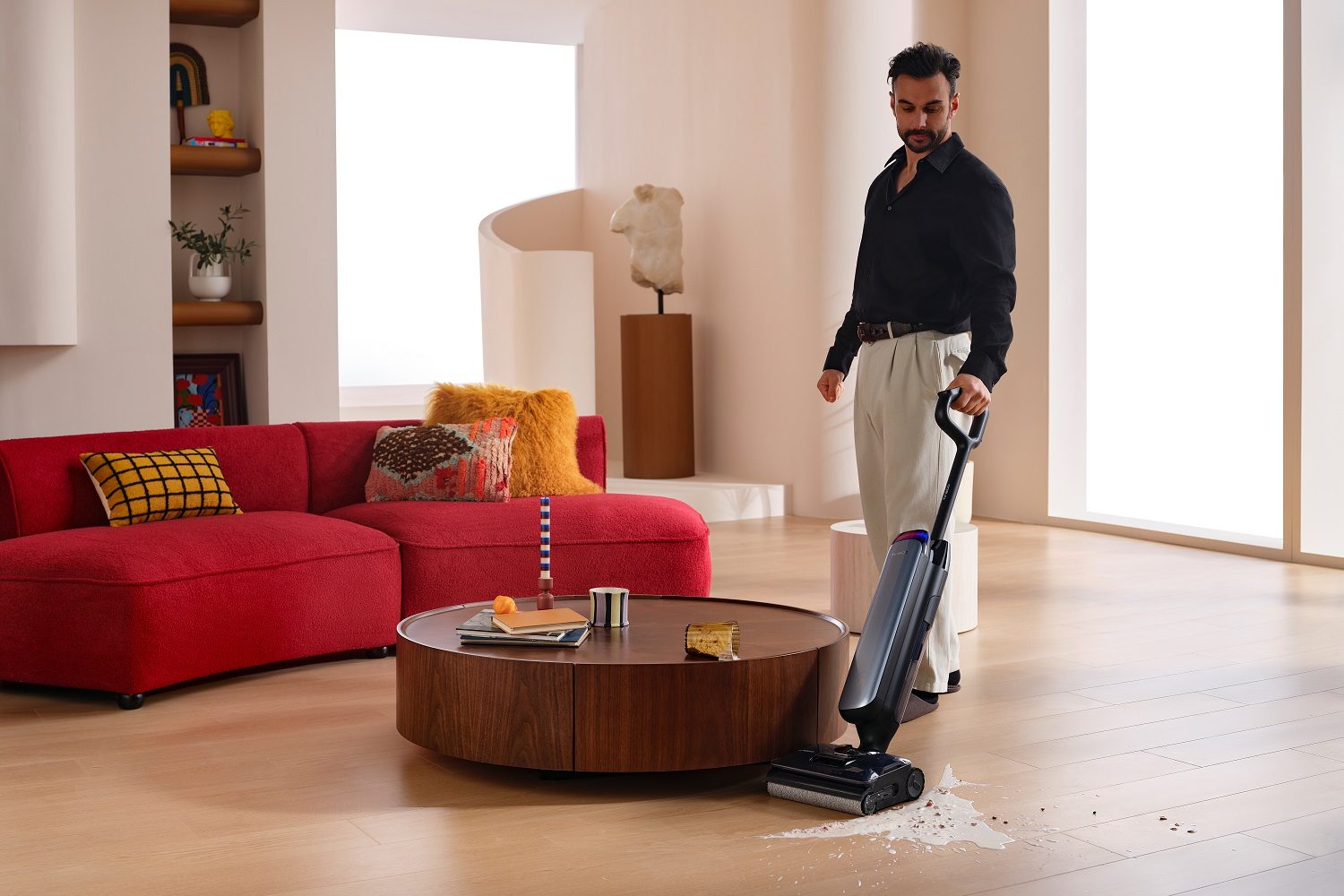 A man using the Tineco Floor One S9 Artist Pro cordless vacuum cleaner.