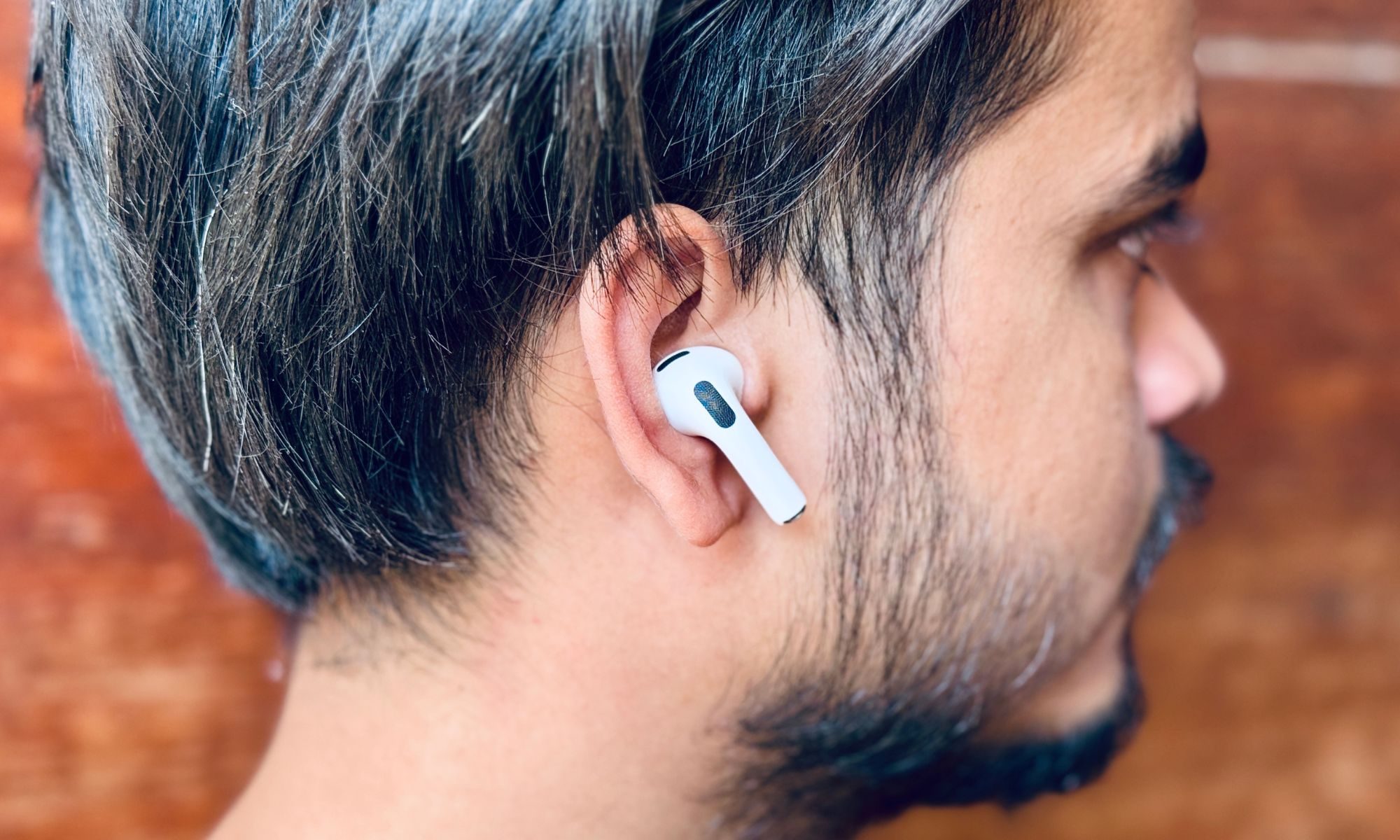 Person wearing AirPods Pro 3.