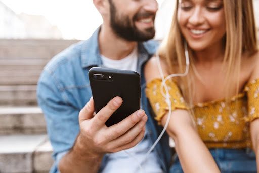Couple looking at a smart phone