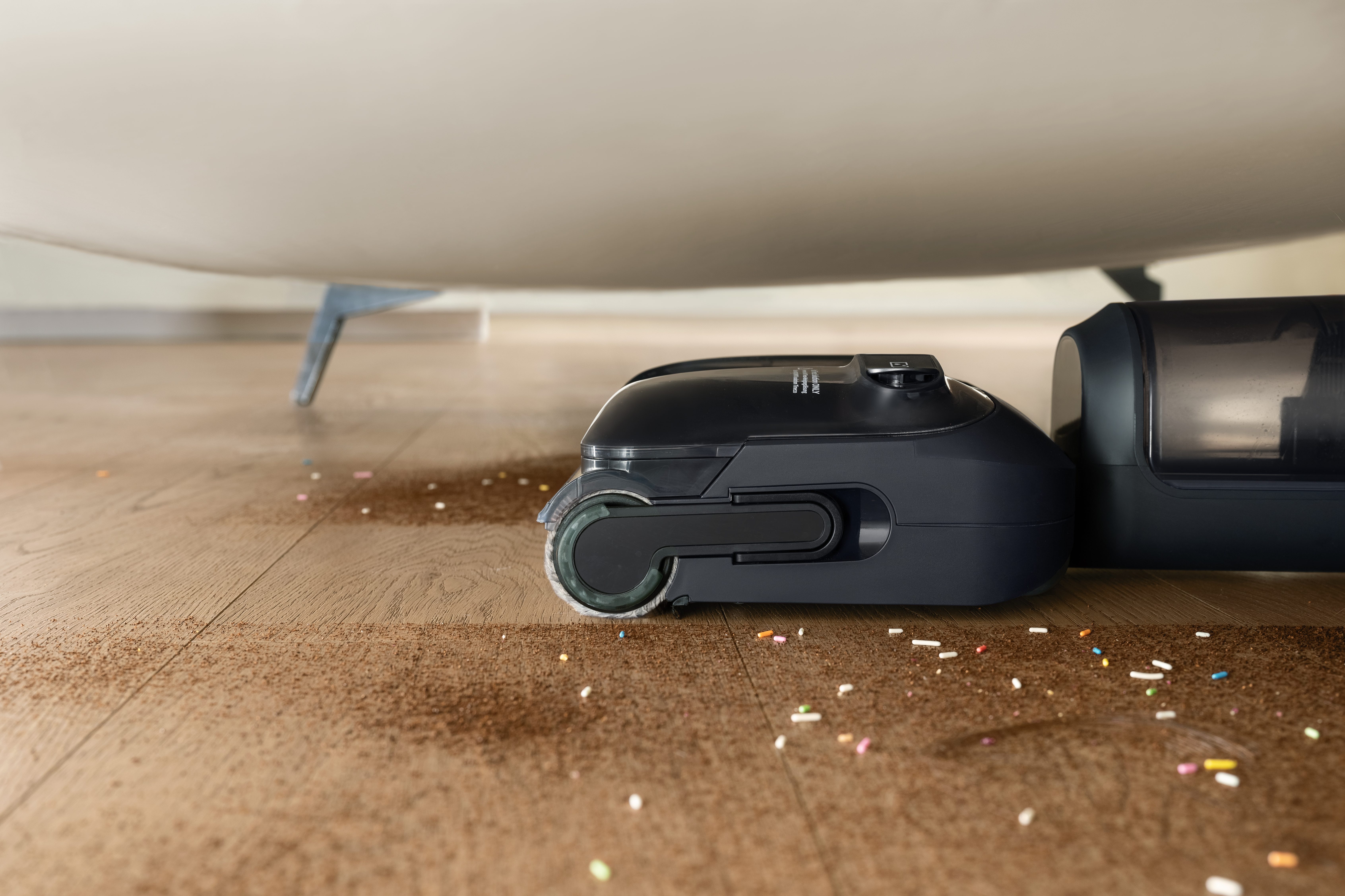 tineco s7 stretch reaching under a couch to clean