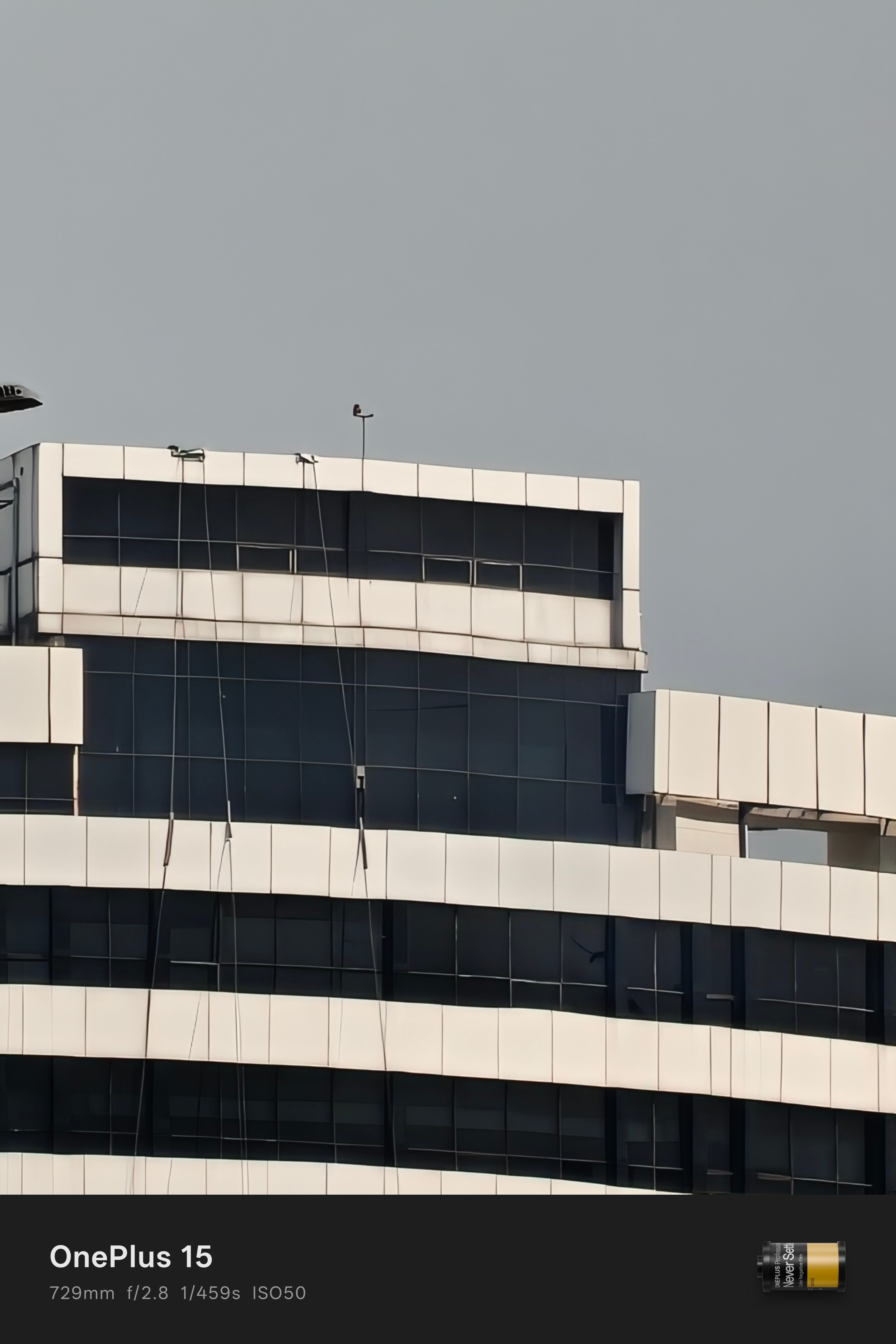 Daylight sample from OnePlus 15 camera of a white building at 30x zoom.