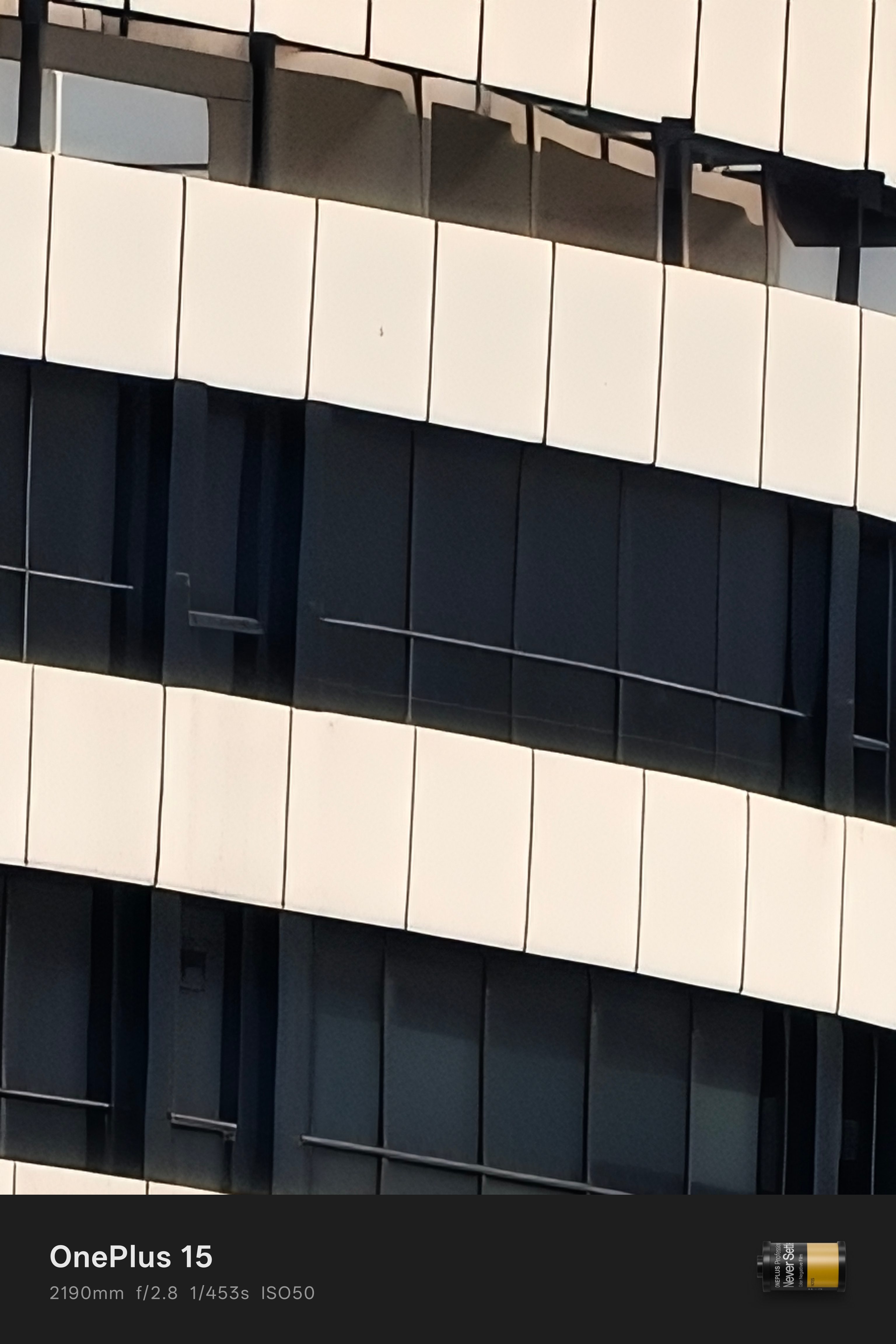 Daylight sample from OnePlus 15 camera of a white building at 90x zoom.
