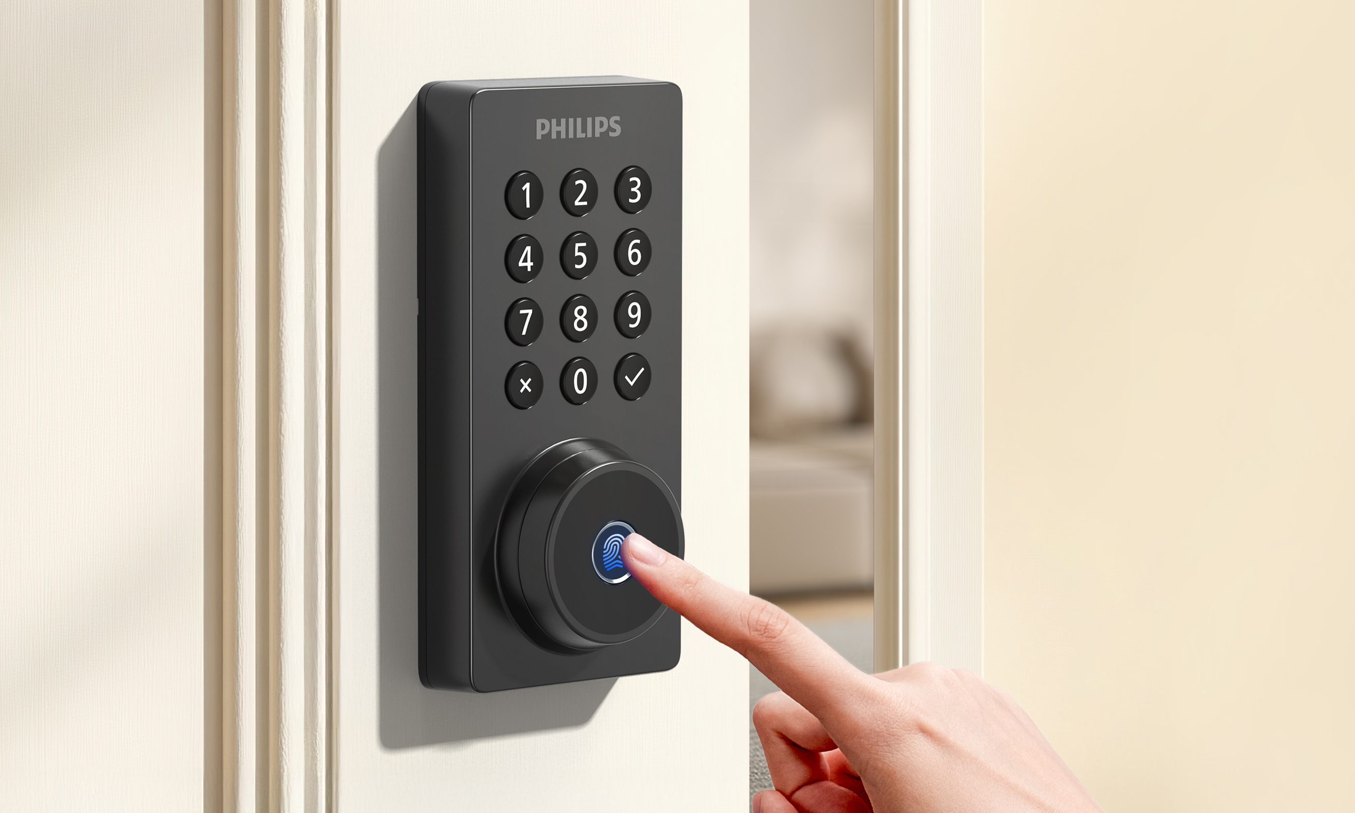 A finger pressing the fingerprint scanner on the Philips 4200 series smart deadbolt