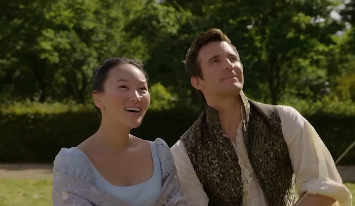 A couple looking up as they fly a kite in Bridgerton season 4