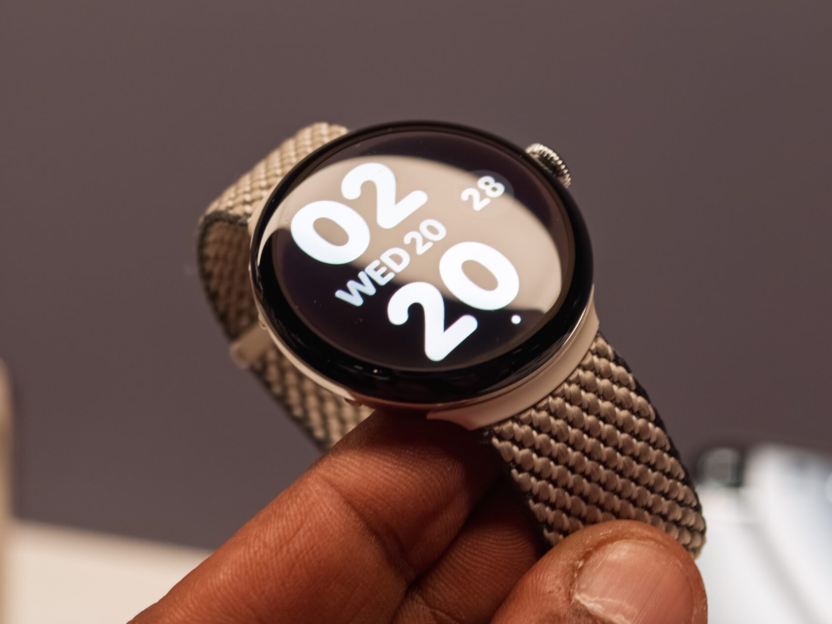 Google Pixel Watch 4 in black in the hand