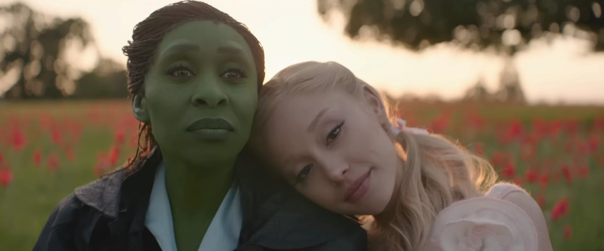 Glinda with her head on Elphaba's shoulder in Wicked For Good.