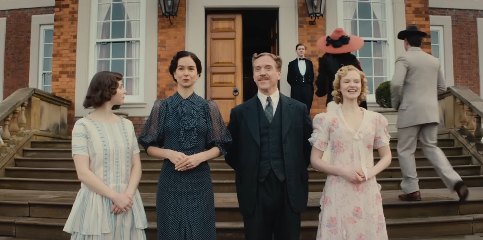 The cast of Fackham Hall standing outside the titular building.