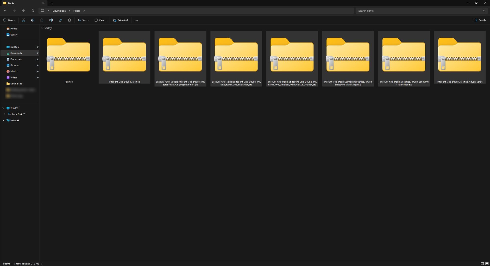 Screenshot of Windows 11 File Explorer showing a Fonts folder with several ZIP files.
