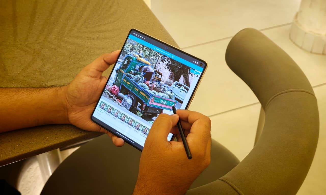 Motorola Razr Fold being used for image editing with the Moto Pen Ultra