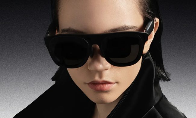 Person wearing Xreal Project Aura smart glasses.