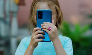 Child using a blue phone