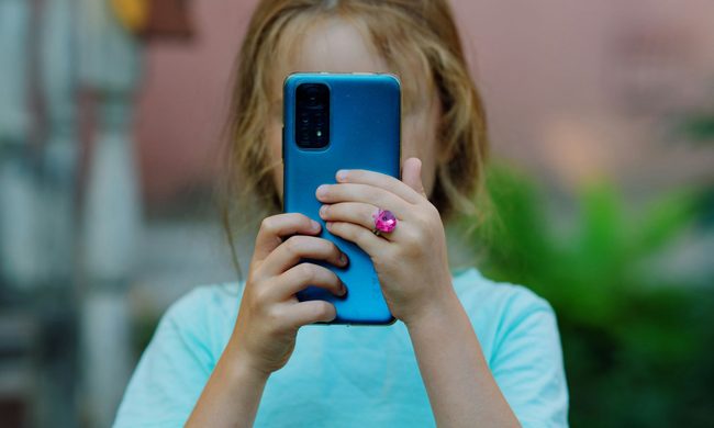 Child using a blue phone