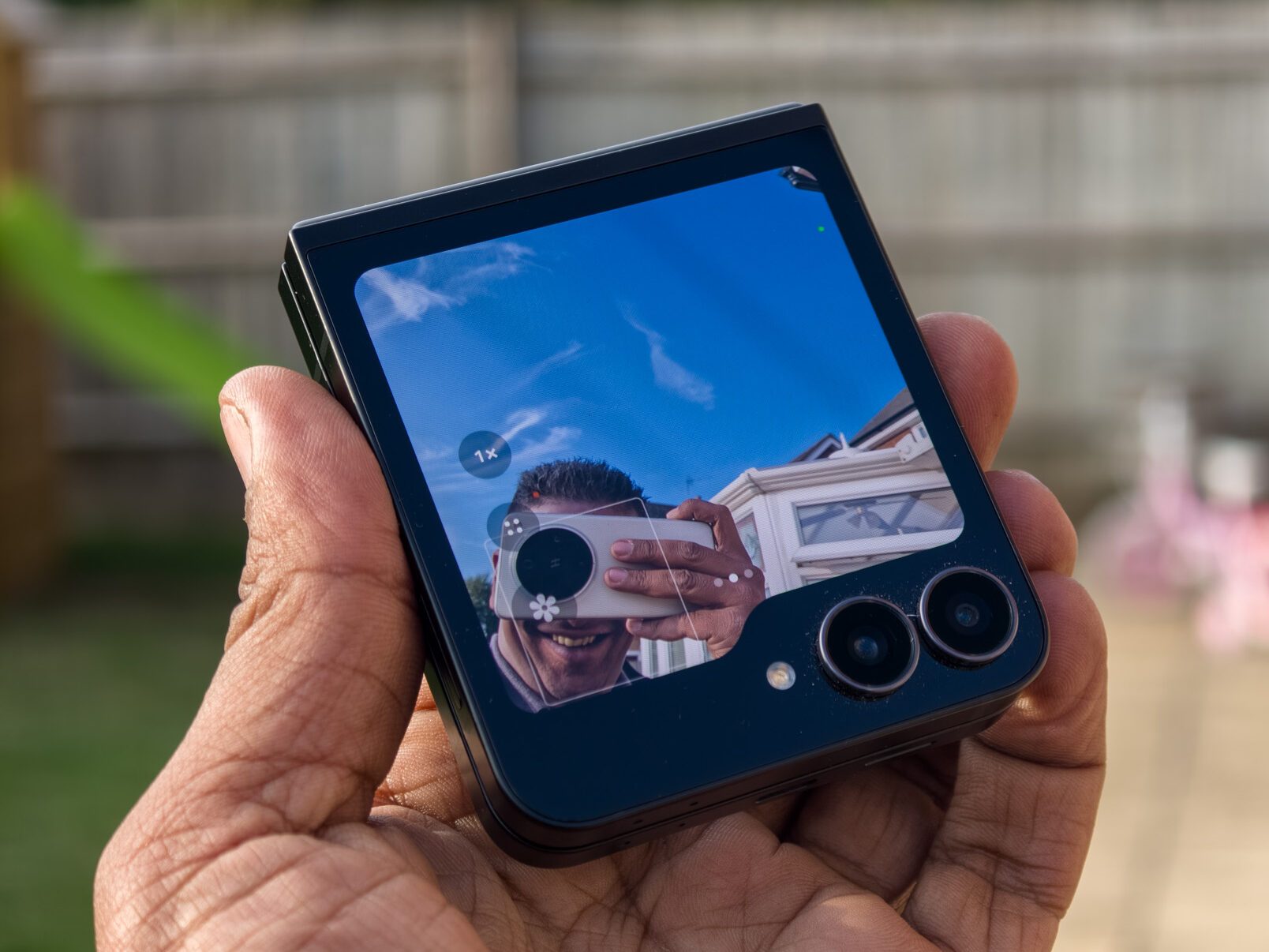 Galaxy Z Flip 7 FE in selfie camera mode using the front screen and main cameras
