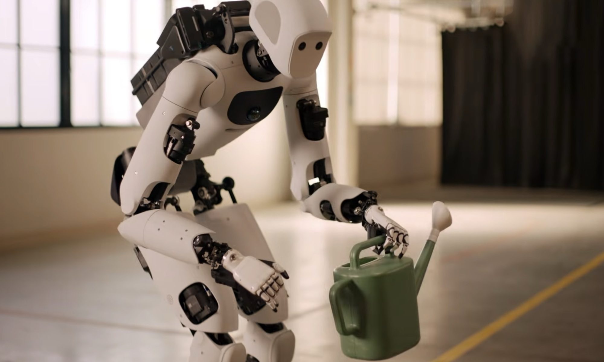 Apollo robot picking up a watering can