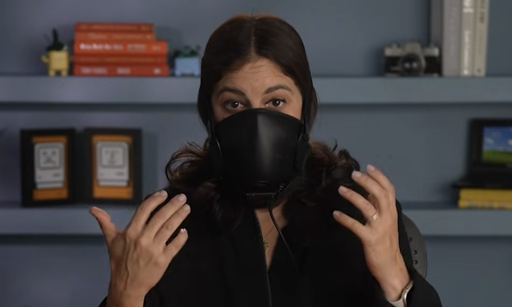Joaana Stern wearing a beak mask