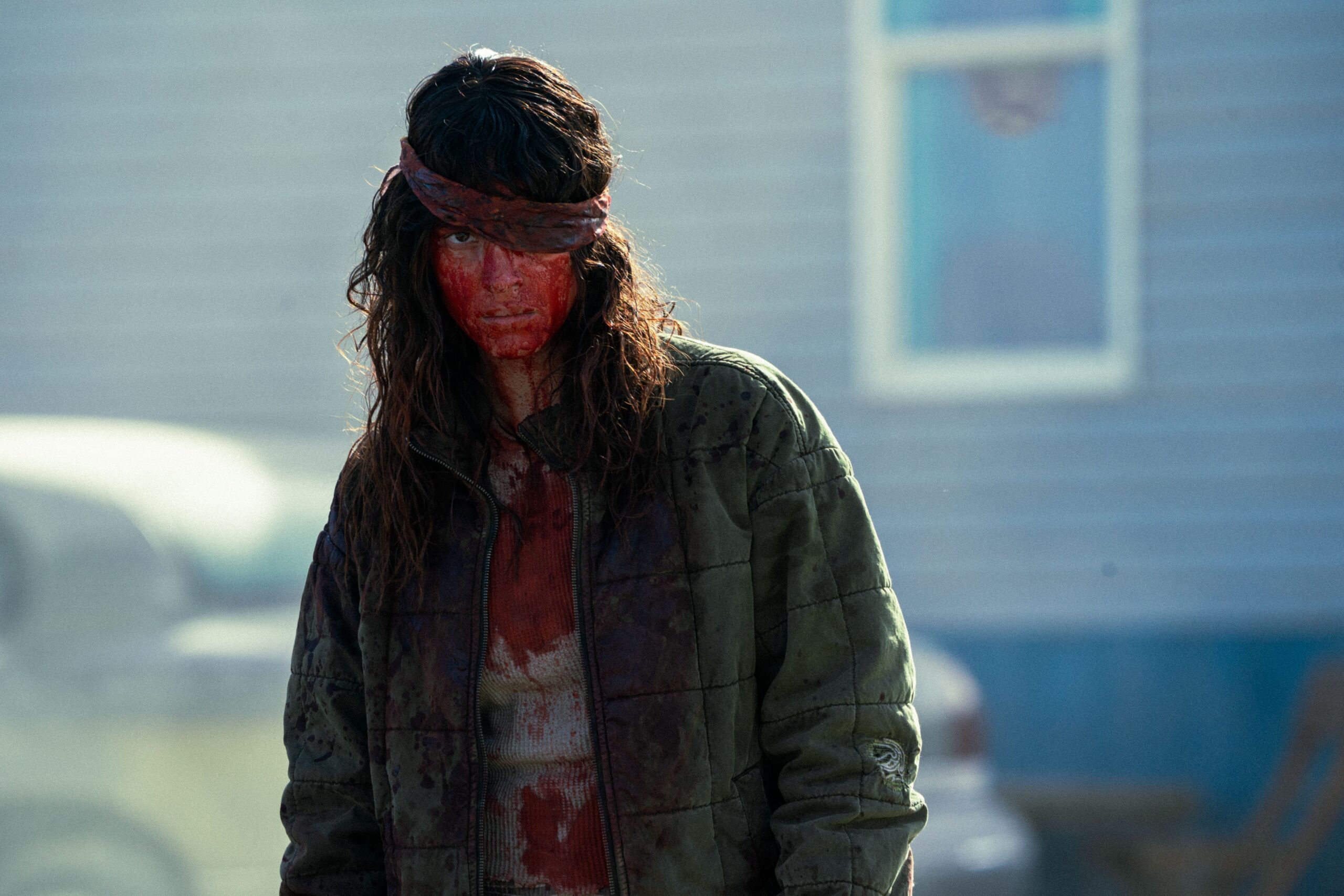 Adria Arjona covered in blood in Onslaught.