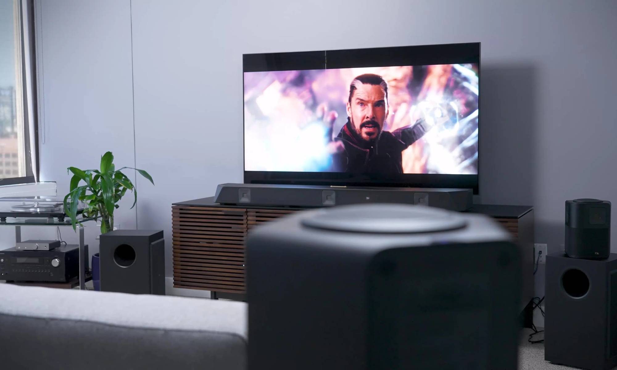 Nakamichi Dragon surround sound system in a room with TV playing Dr. Strange
