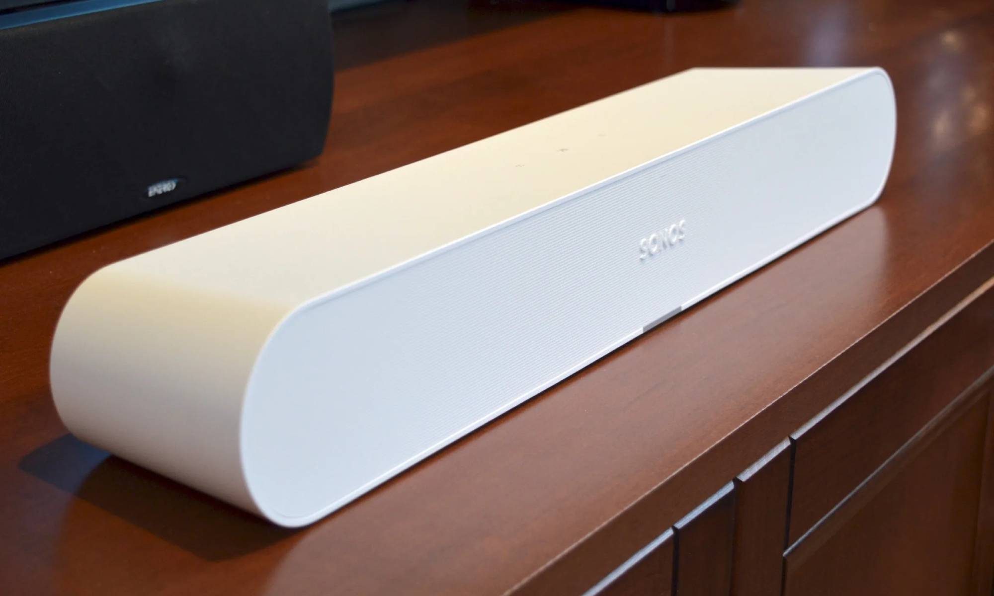 Sonos Ray soundbar on a wooden cabinet