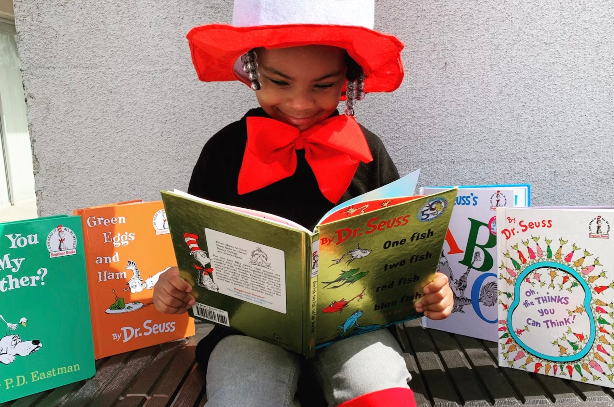 A kid reading a book.