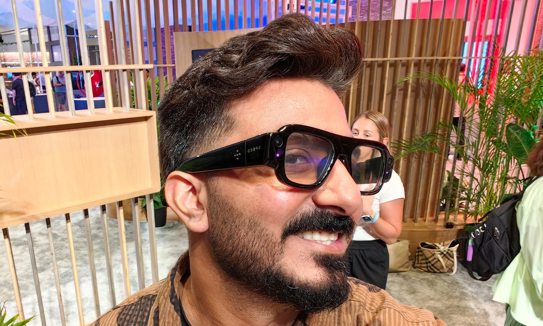 Man wearing Snap SPECS hands on angled shot