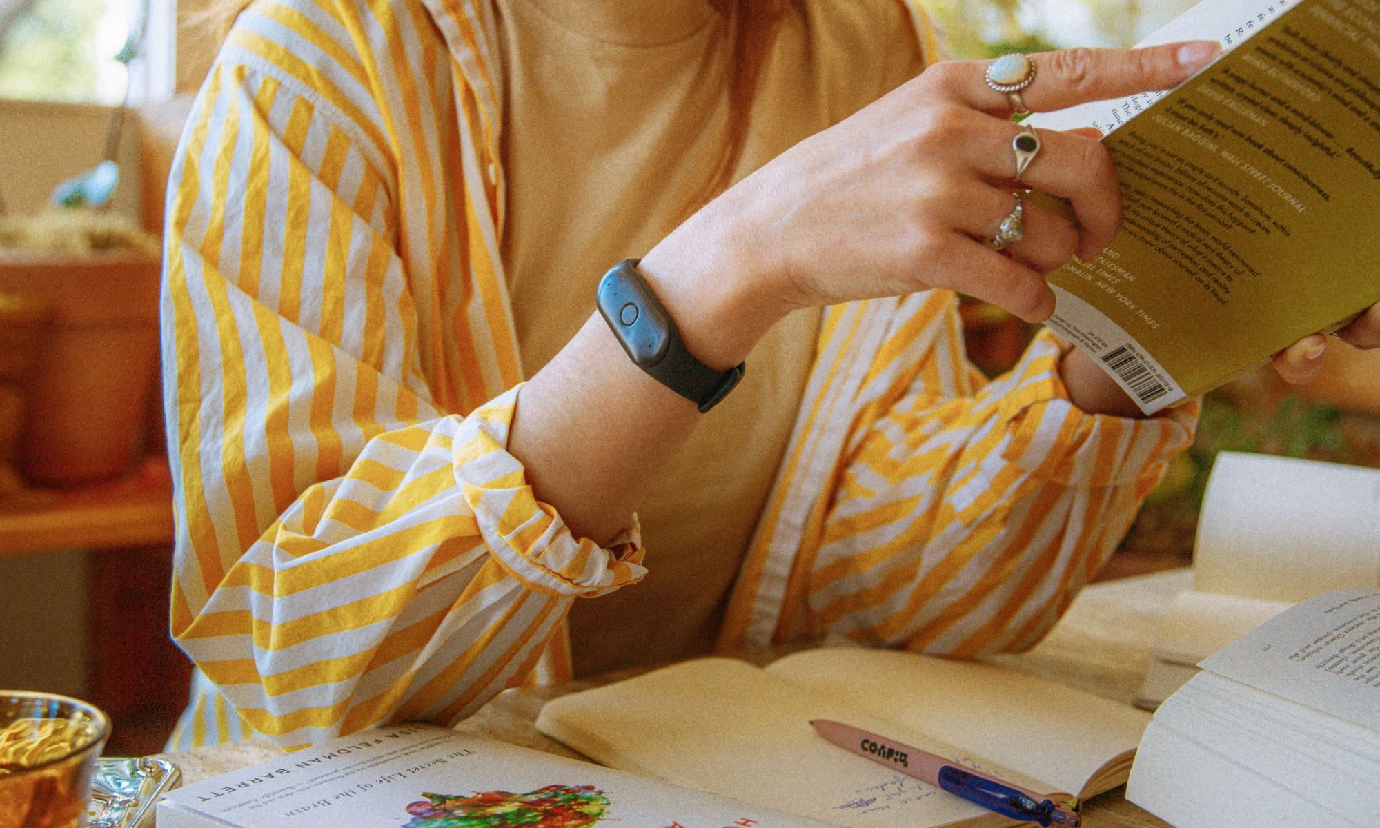 Person wearing a Bee wristband
