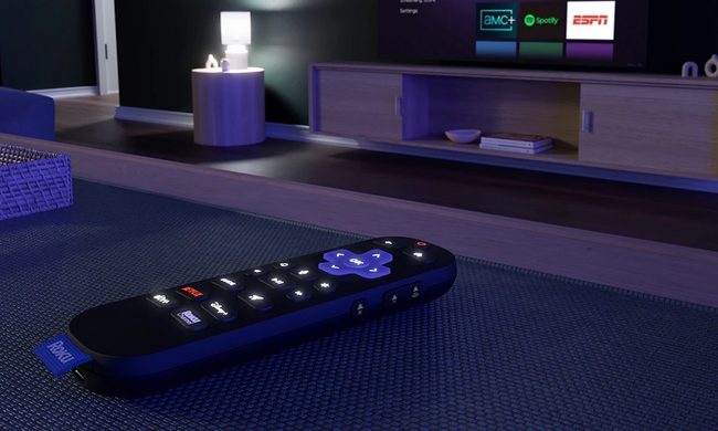 Roku Voice Remote Pro (2nd edition) displaying backlit buttons in a darkened room