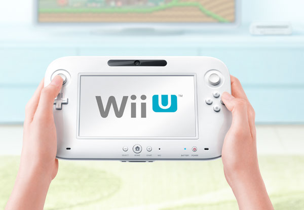 Nintendo Wii U controller, console in background