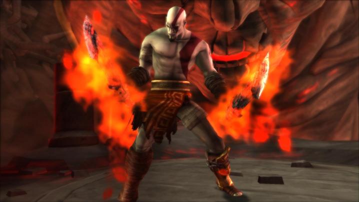 Kratos holding burning blades.