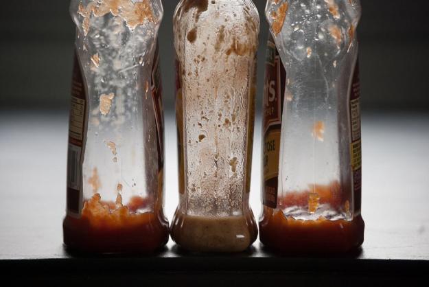 Nearly empty condiment bottles