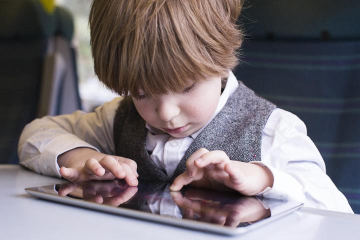 Kid using iPad