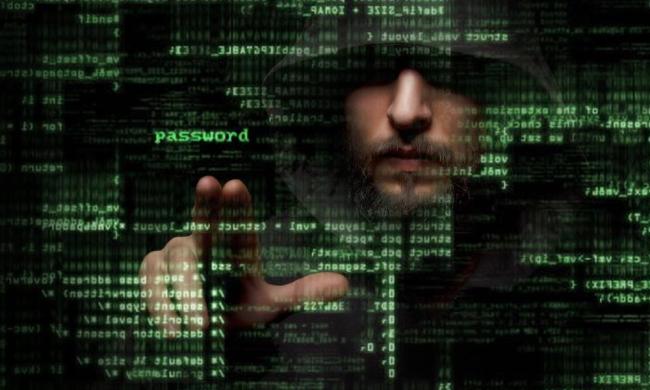 A depiction of a hacker behind a screen of code.