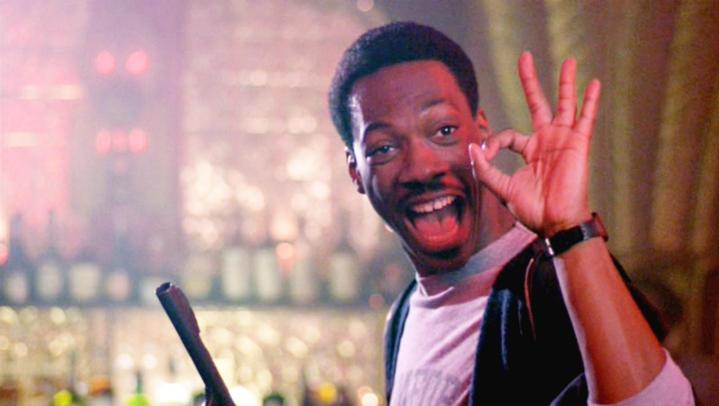 Eddie Murphy signals that all is okay in Beverly Hills Cop. 