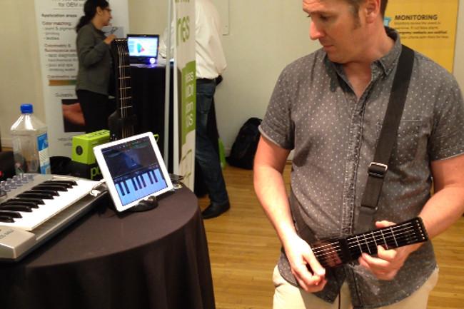 miniature guitar turns ipad music teacher recording studio jamstik