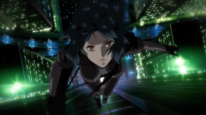 Special agent Motoko Kusanagi falls through the sky above a neon city in a scene from 1995's Ghost in the Shell.