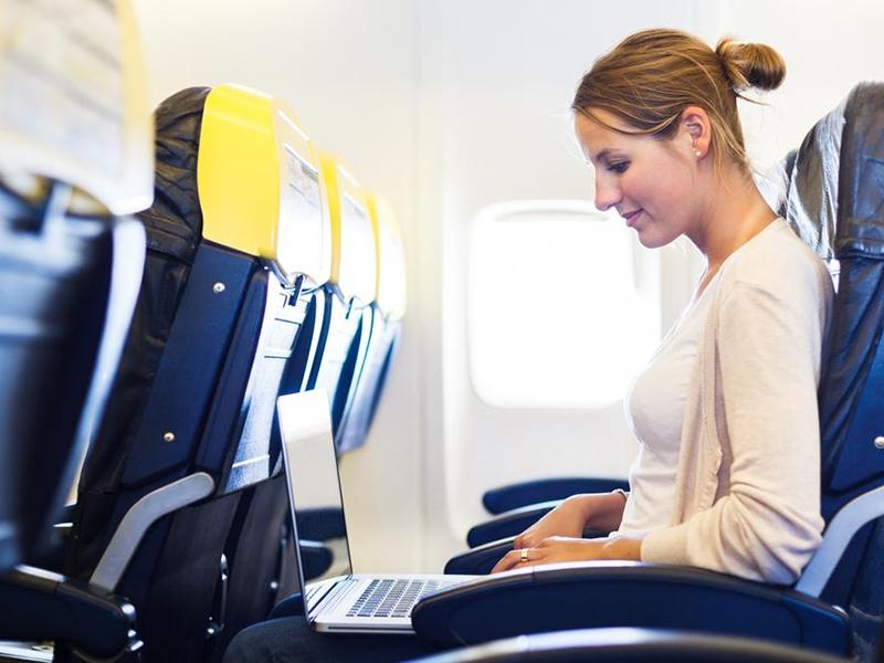 flight attendants rather gadgets stayed switched woman on plane with laptop