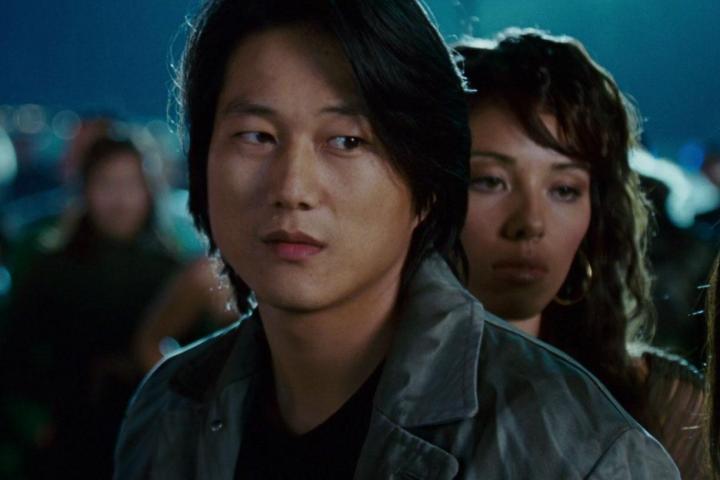 Han stares with a side eye in Tokyo Drift.