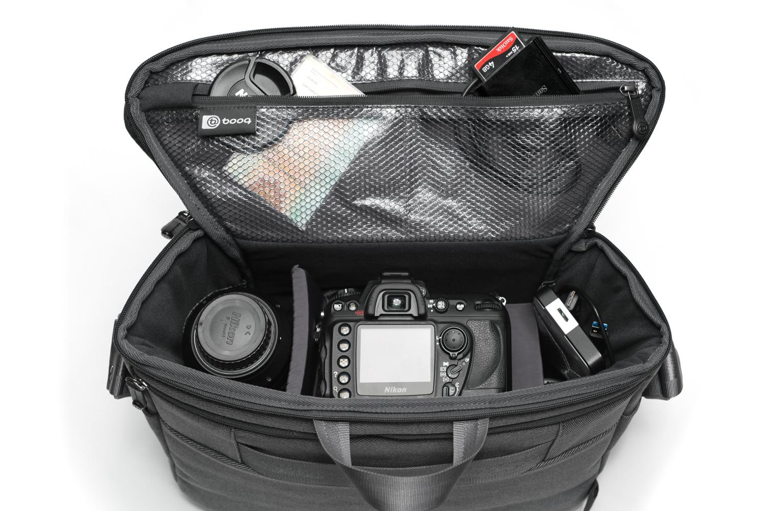 squeeze 2 dslrs and laptop into booqs python catch bag theres still room booq 7