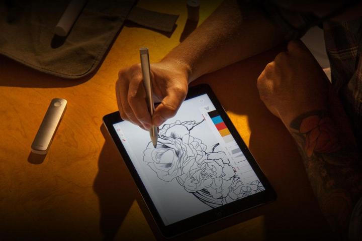 Sketching on a tablet screen with the Adobe Ink & Slide stylus.