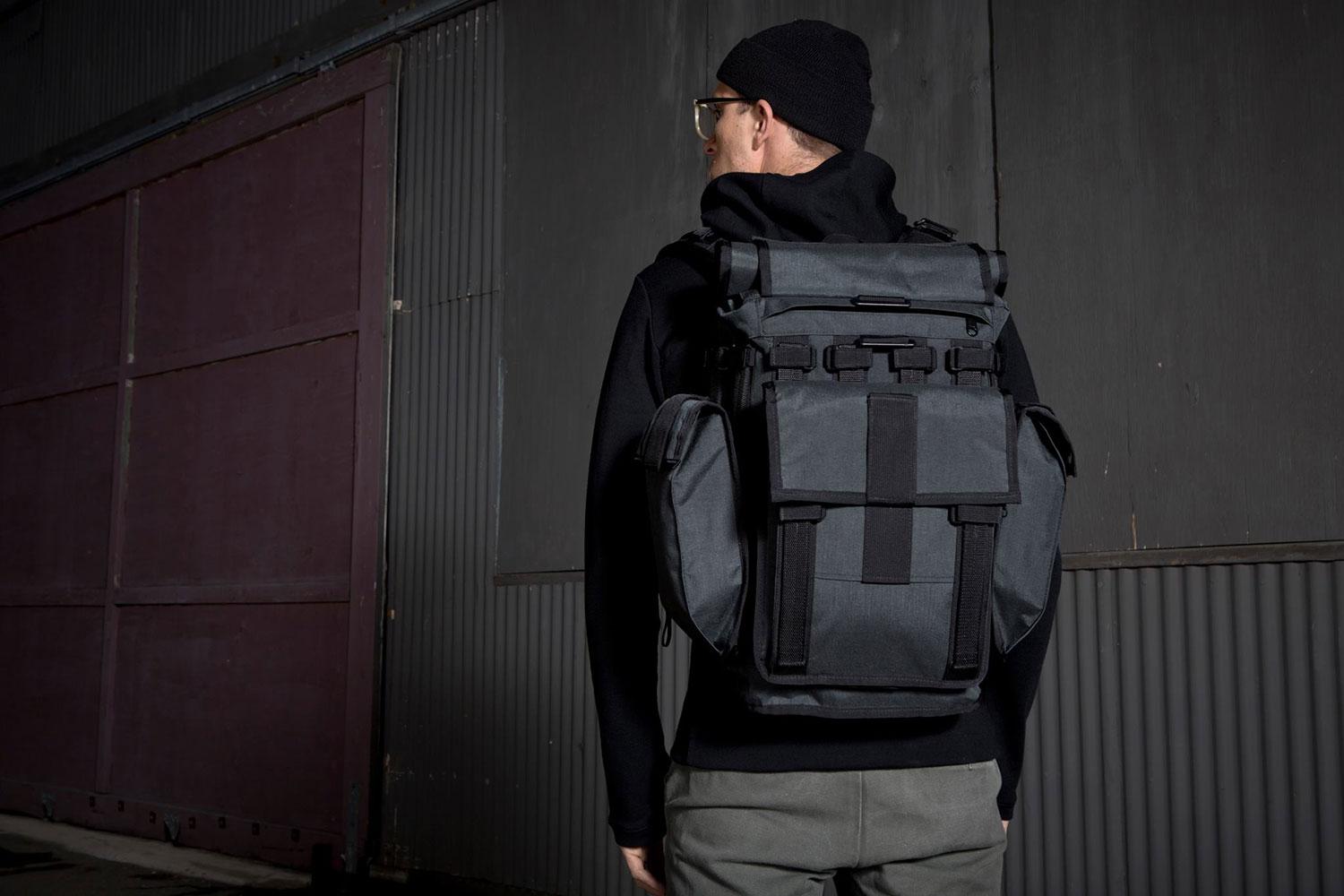 Rear view of a person wearing a Mission Workshop R6 Arkiv Field Pack.