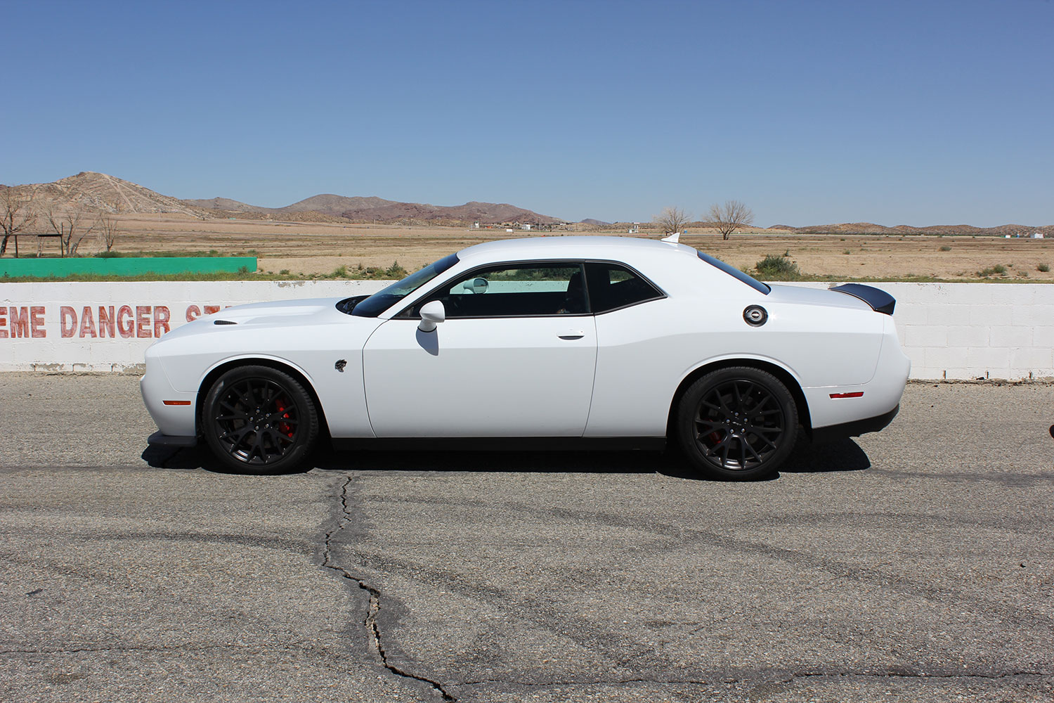 2015 dodge charger challenger srt hellcats track review and hellcat on side white