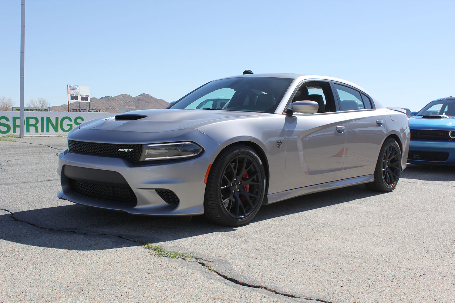 2015 dodge charger challenger srt hellcats track review and hellcat on silver angle