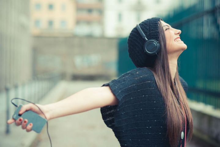 spotify releases year end data for users headphones girl smartphone