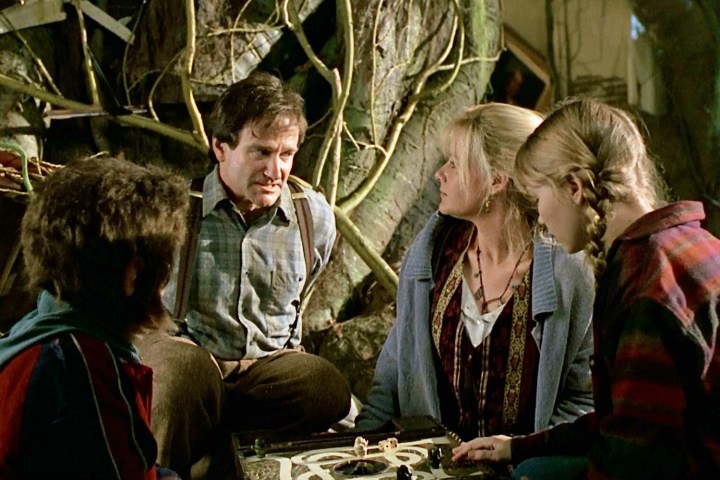 Robin Williams, Bonnie Hunt, and the kids sit around a table in Jumanji.