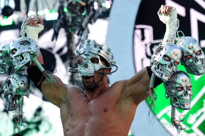 wrestler holding a lot of terminator heads