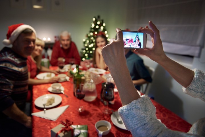 how to take great holiday photos with your phone unrecognizable person taking photography of the family